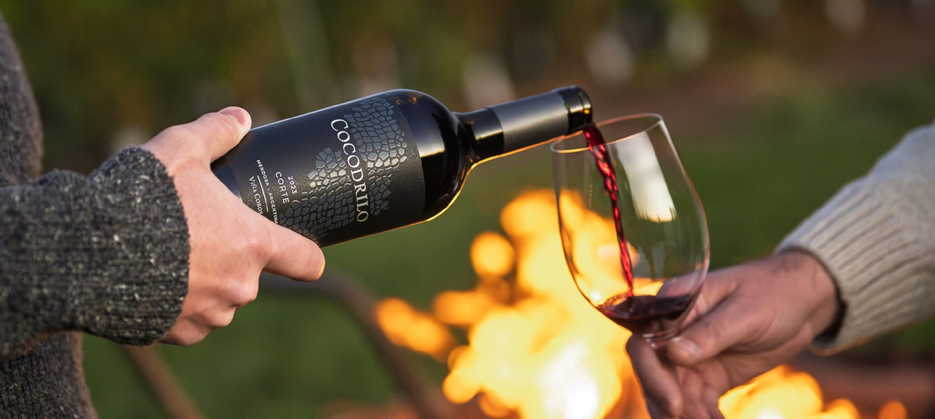 Pouring the 2023 Cocodrilo Corte by a fire