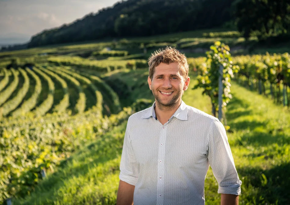 Markus Huber standing in his terraced Traisental vineyards in Austria